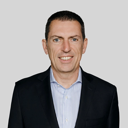 Headshot of Didier Delvaux