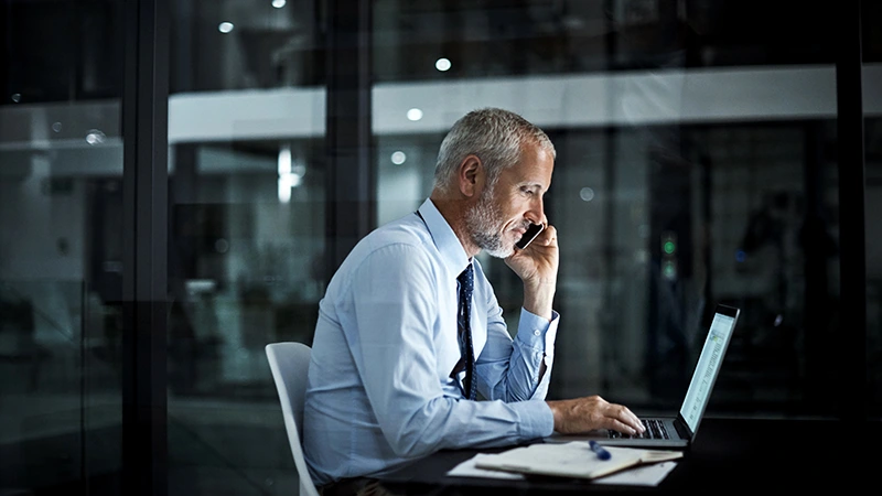 Middle aged professional man talking on a cell phone