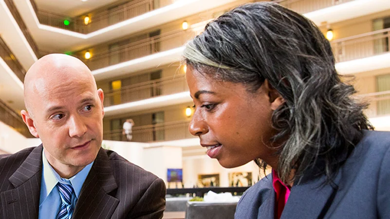 One man and woman discussing depositary services.